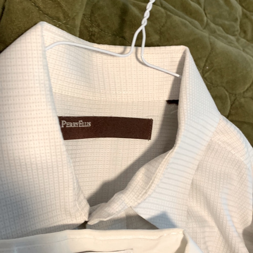 White dress shirts.  Two Van Heusen, one Geoffrey Beene and one Perry Ellis.